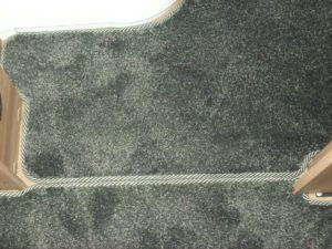 Grey caravan carpet edged in Easybind