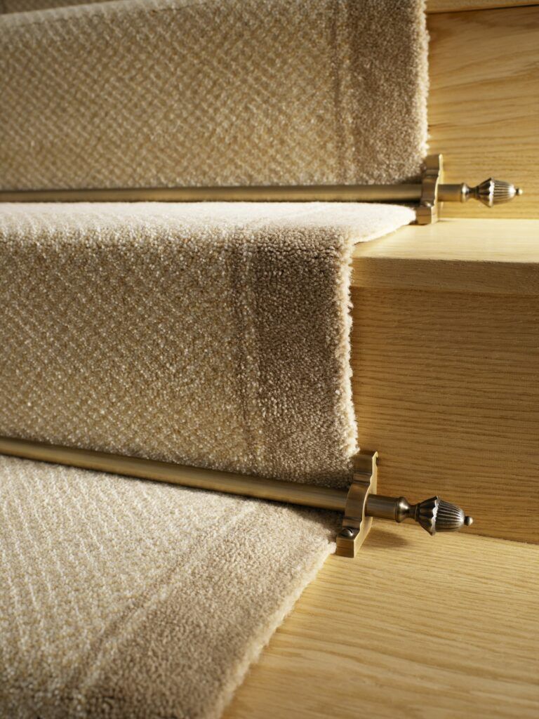 Dubair stair rods in antique brass on carpet stair runner