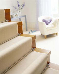 Cream stair runner fitted with Crystal Sky runner carpet rods in chrome, made to measure