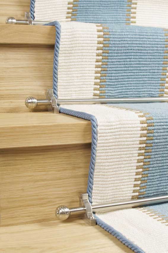 pale blue carpet binding tape edges a stripy stair runner