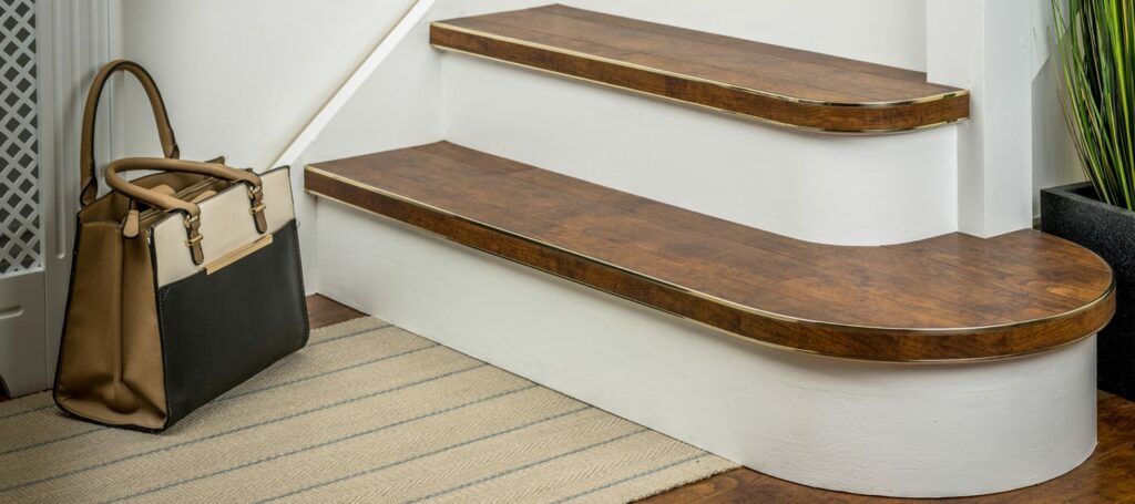 Curved stair nosing uk features Bendybull stair nosing fitted to LVT on stairs