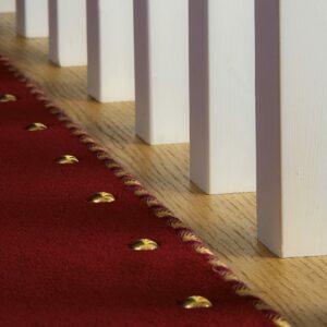Easybind carpet binding with matching carpet studs on staircase create attractive stair runner