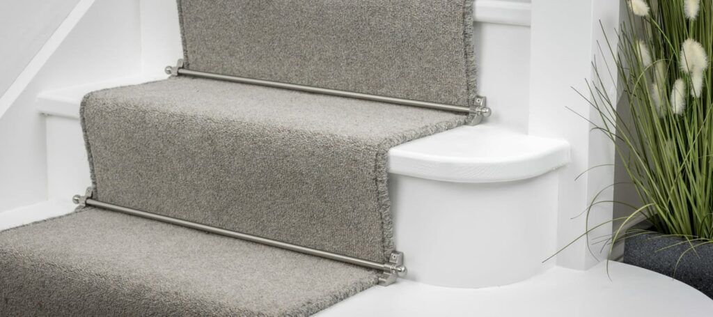 The latest trends in stair rods includes 9mm Jubilee carpet rods shown on grey runner carpet