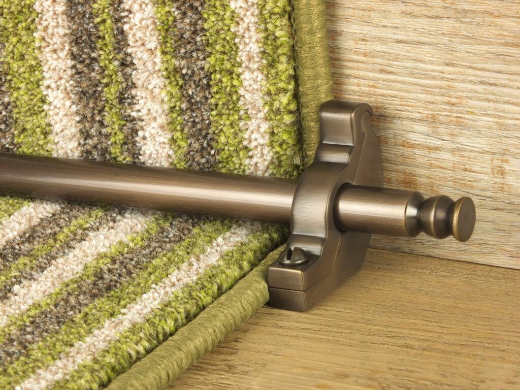 Balmoral stair rod with bracket on striped green stair runner