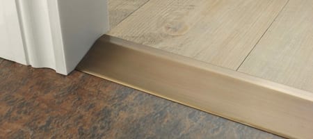 Premier Ramp antique brass ramp from wood to LVT