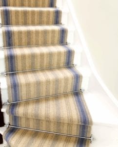 Blue striped staircase fitted with Sherwood stair rods in chrome