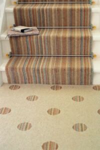 Stair runner ords with amber crystal ends fitted to beige striped stair runner