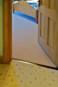 Posh door thresholds fitted on landing, carpet to carpet