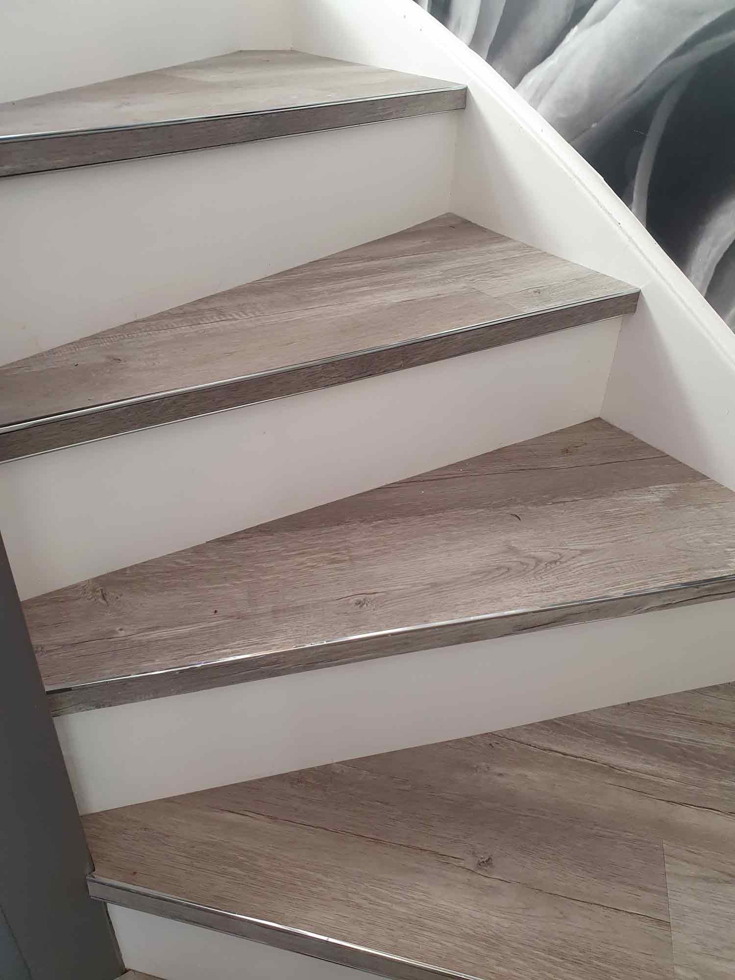 Premier bendy bull stair edge fitted to winding staircase fitted with wood-look LVT