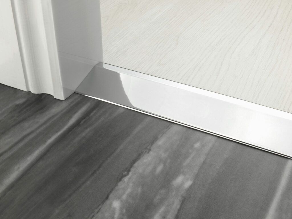 Uneven door thresholds 20mm Ramp in chrome joining wood and LVT