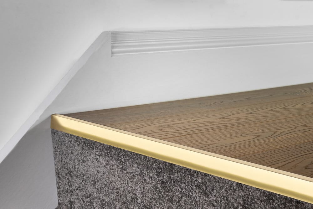 Ali Top Nose stair nosings for laminate in brass finish